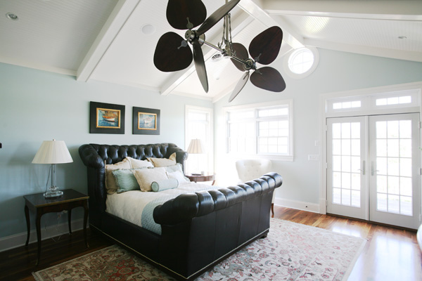 The eye-catching fan creates inspiration in beach home bedroom